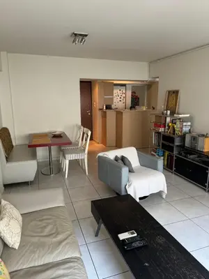 a living room with a couch and a table at Georgia's house in Athens