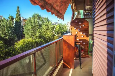 an outdoor balcony with a view of trees at Mary's Apartment, Athens Zografou in Athens