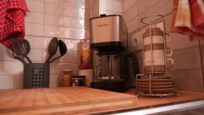 a kitchen counter with a blender and a cutting board at Classic Athenian house 2mins from metro in Athens