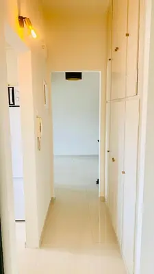 a hallway with a white door in a room at Kostas Athens Residence in Athens