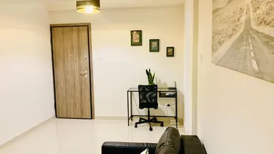 a living room with a couch and a door at Kostas Athens Residence in Athens