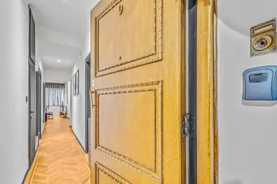 a large wooden door in a hallway at City Vibes Kolonaki in Athens