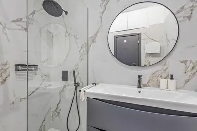 a bathroom with a sink and a mirror at City Vibes Kolonaki in Athens