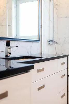 a bathroom counter with a sink and a window at Elegant Coastal Haven Fully Renovated 3-Bedroom Apartment in Athens