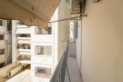 a view of a balcony of a building at Pagrati Cozy Retreat in Athens
