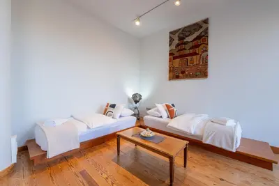 a living room with a couch and a table at Spacious 2-Bdrm Apt at Filopappou hill in Koukaki! in Athens