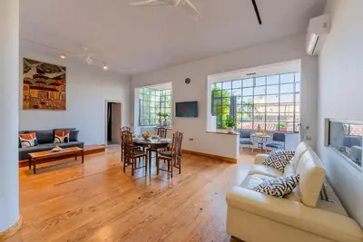 a living room with a couch and a table at Spacious 2-Bdrm Apt at Filopappou hill in Koukaki! in Athens