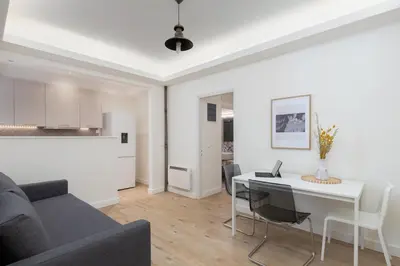 a living room with a couch and a table at Cosy Athens Downtown Apartment in Athens