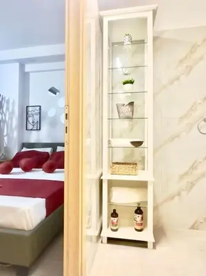 a bedroom with a bed and a book shelf at NEW Boutique Athens HEART Kypseli in Athens
