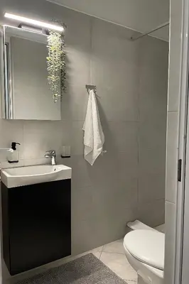 a bathroom with a sink and a toilet at Zefi's Loft - Sea View in Piraeus in Piraeus