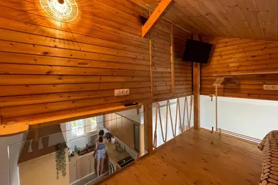 an overhead view of a kitchen in a wooden house at Zefi's Loft - Sea View in Piraeus in Piraeus