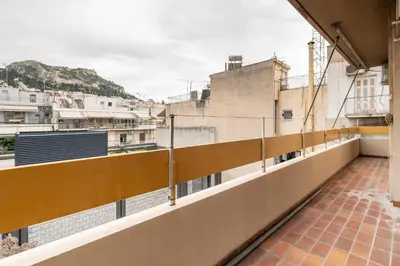 a balcony with a view of a city at Lycabettus view Vintage penthouse flat in Exarchia in Athens