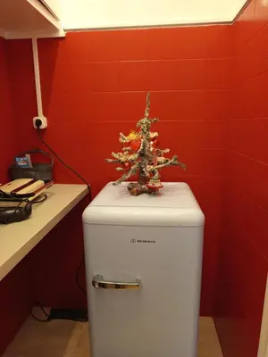 a christmas tree on top of a toilet in a bathroom at Exarcheia cozy nest in Athens