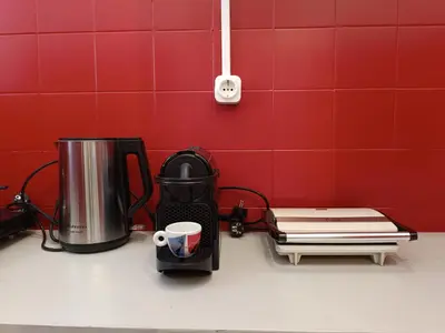 a kitchen counter with a coffee maker and a coffeemaker at Exarcheia cozy nest in Athens