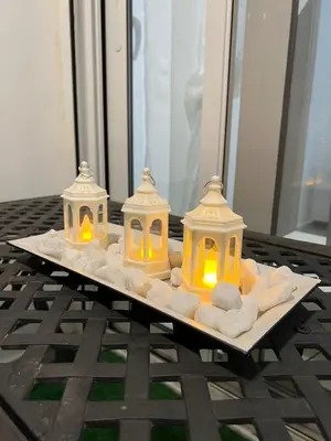 a tray with three candles on a table at Terrace Garden Close To Sea in Athens