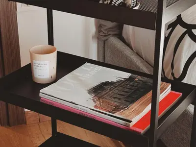 a table with a book and a cup on it at Have a Rest Netflix, Nespresso in Athens