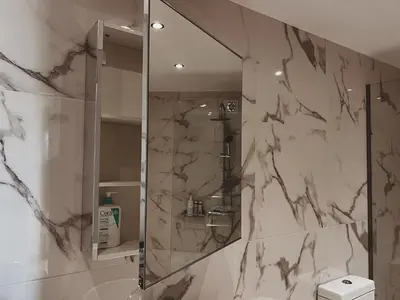 a bathroom with a shower with a mirror at Have a Rest Netflix, Nespresso in Athens