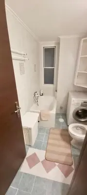 a bathroom with a toilet and a sink at Styl Apartment in Athens