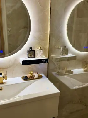 a bathroom with a white sink and a mirror at luxury house airport in Koropíon