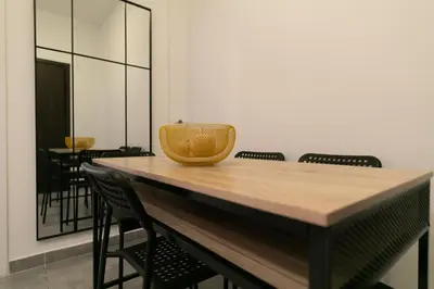 a table with chairs and a basket on top of it at Koukaki Gem Chic Apt near Acropolis in Athens