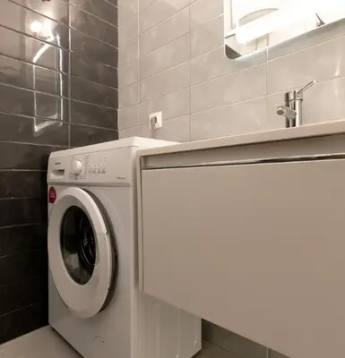 a white washer and dryer in a bathroom at Koukaki Gem Chic Apt near Acropolis in Athens