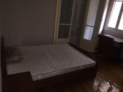 a bed in a room with a window and a door at Work, relax, enjoy - SHARED APARTMENT in Athens
