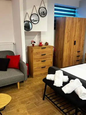 a bedroom with a bed and a couch at NEW COSY HOME KYPSELI ATHENS heart! in Athens