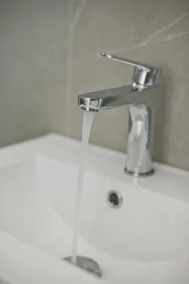 a stream of water coming out of a faucet at Porto 118 New Reno Piraeus St near Marina Zeas, AC in Piraeus