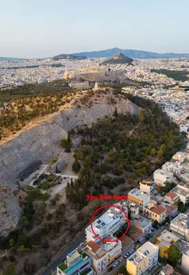 an aerial view of a city with a red circle at Amazing View Studio at Filopappou Hill in Koukaki! in Athens