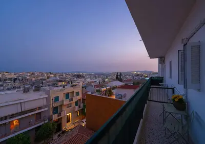 a view of a city from an apartment balcony at Amazing View Studio at Filopappou Hill in Koukaki! in Athens
