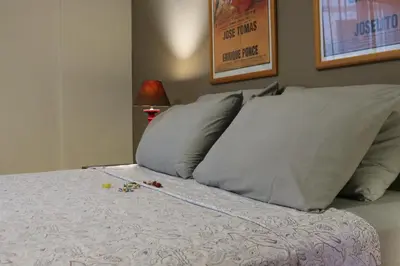 a bed with two pillows on it with at Central Apartment near Archeological Museum in Athens