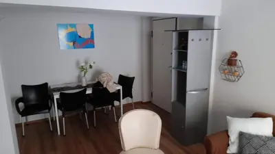 a kitchen with a table and chairs in a room at Ισόγειο διαμέρισμα με υπαίθριο χώρο in Athens