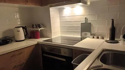 a kitchen with a sink and a counter top at Ισόγειο διαμέρισμα με υπαίθριο χώρο in Athens