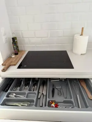 a stove top oven sitting inside of a kitchen at Beach rooftop Athens Riviera in Athens