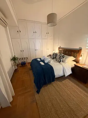 a bedroom with a large bed in a room at Beach rooftop Athens Riviera in Athens