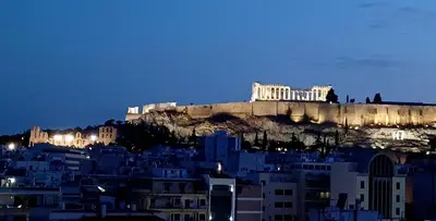 a view of the acropolis of athens at night at cozy διαμέρισμα με υπέροχη θέα ! in Athens
