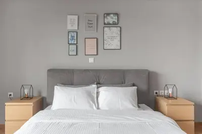 a bedroom with a large bed with two night stands at Charming Acropolis view modern design House 2BD in Athens