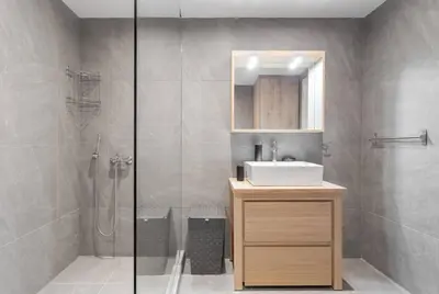 a bathroom with a sink and a shower at Charming Acropolis view modern design House 2BD in Athens