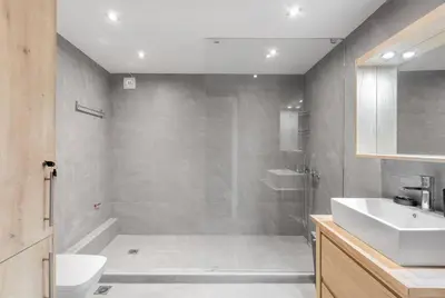 a bathroom with a shower and a sink at Charming Acropolis view modern design House 2BD in Athens