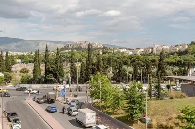 a busy city street with cars on the road at Charming Acropolis view modern design House 2BD in Athens