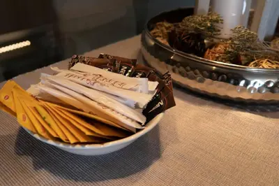 a bowl of napkins on a table with a plate of food at Stunning Acropolis view modern design house 2BD in Athens