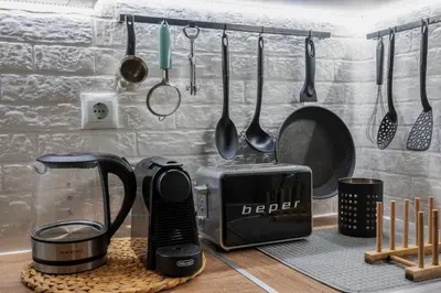 a kitchen counter with a toaster coffee maker and utensils at Acropolis Hidden Gem- The perfect Athenian Hideaway in Athens