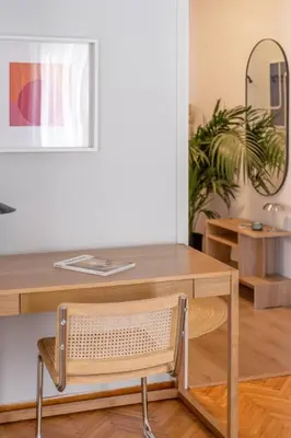a wooden table with a chair and a desk at Faliro Serenity 2BD Apartment by UPSTREET in Athens
