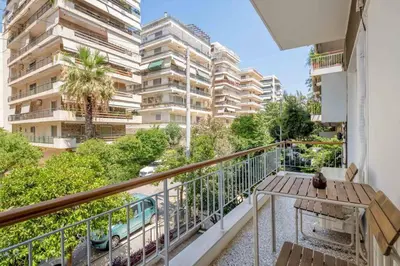 a balcony with a view of a building at Faliro Serenity 2BD Apartment by UPSTREET in Athens