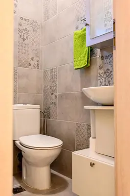 a bathroom with a toilet and a sink at Marina's dream house in Sounio