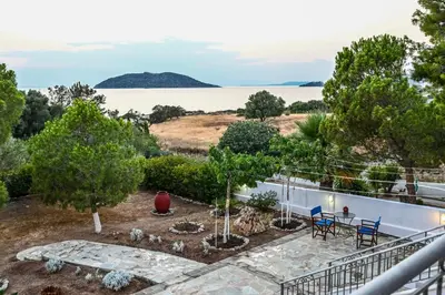 a balcony with a view of the water at Marina's dream house in Sounio