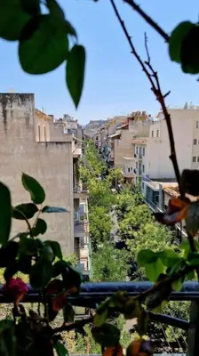 a view of a city with buildings on a hill at Aphrodite's Nest in Athens