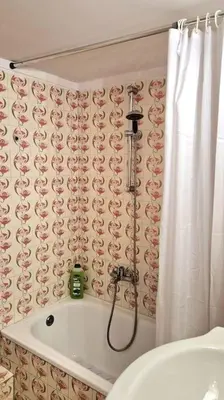 a bathroom with a shower and a bath tub at Aphrodite's Nest in Athens