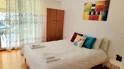 a bedroom with a bed with towels on it at Aphrodite's Nest in Athens