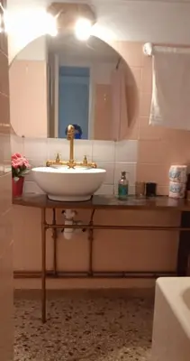 a bathroom with a sink and a mirror on a counter at Flat 32 penthouse in Athens